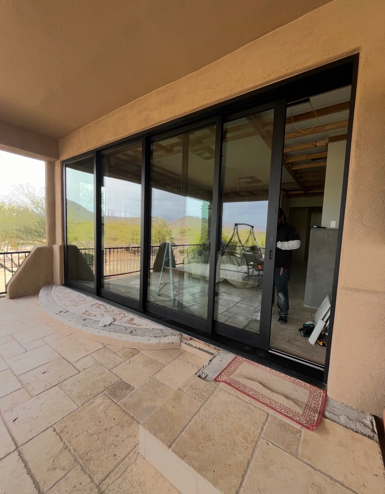 Multipanel sliding door cut-out with desert mountain views
